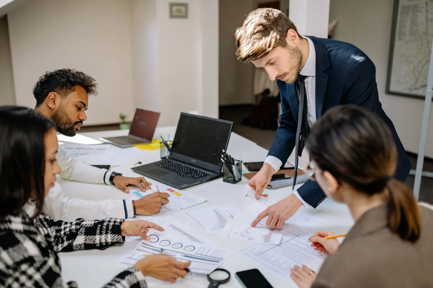 A finance team working through reports in a modern office
